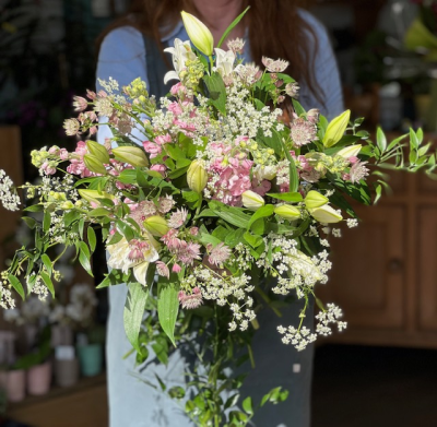 Meadow Whisper - A delicate gathering of soft pastel blooms, gently picked to evoke the quiet beauty of a sunk-dappled meadow.  Featuring gentle hues of blush pinks, creamy peach, lavender and soft greens, Meadow Whisper brings a natural, effortless charm - perfect to cherish the simple grace of the countryside.