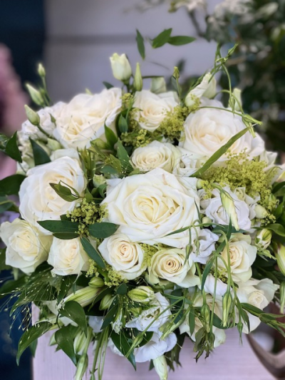 Neutral arrangement - Inspired by the timeless elegance of an English rose garden, this design is a dreamy embrace of soft ivory blooms, layered with lush greenery and delicate textures.