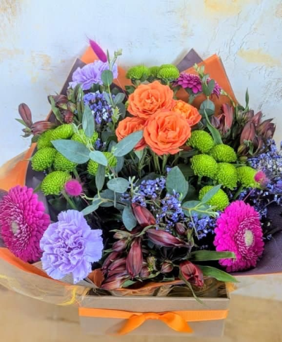 Autumn Carnival - A lively burst of orange, deep berry, and lilac tones dances among fresh greenery, balanced with touches of earthy warmth.  The bold colours capture the spirit of crisp autumn days, where the season’s richness is celebrated in every shade- from glowing sunsets to the vibrant energy of harvest festivals.