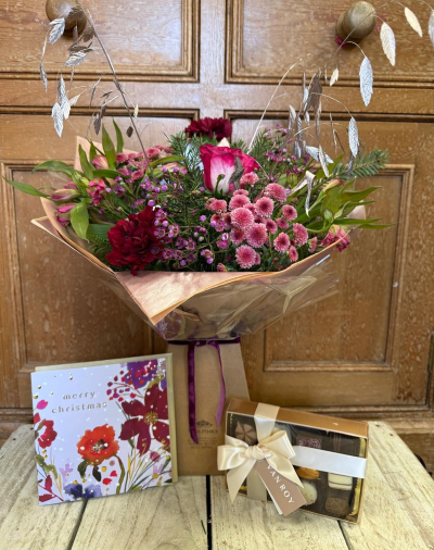 Mulled berry bundle - Mulled Berry Magic Gift Bundle
A beautifully indulgent gift designed to delight all the senses. Our Mulled Berry Magic Gift Bundle pairs one of our most loved seasonal bouquets with thoughtful festive treats, making it the perfect way to celebrate Christmas or send winter cheer.

At the heart of the bundle is our Mulled Berry Magic bouquet — a rich, wintry arrangement of deep berry tones, cerise pinks and seasonal foliage, inspired by the comforting aromas of mulled wine and festive evenings. Accented with elegant silver details, this bouquet brings warmth, texture and a touch of seasonal sparkle.

The bouquet is accompanied by a luxury box of artisan chocolates, beautifully presented and ready to enjoy, along with a festive Christmas card so your message can be shared in style.

Perfect as a gift for loved ones, a thank you, or a festive treat for yourself, this bundle arrives thoughtfully presented and ready to make someone’s day extra special.