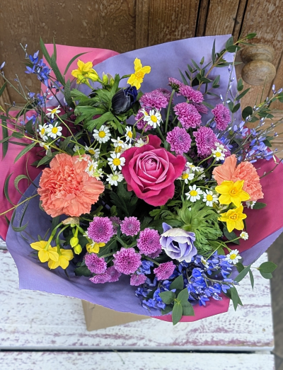 Spring whisper - A joyful blend of soft pastels and vibrant brights, Spring Whisper captures the feeling of the season’s first warm breeze. This fragrant bouquet is full of light, texture, and movement—delicate petals nestled among cheerful pops of color, all wrapped in fresh, airy tones. It’s designed to lift spirits, fill a room with gentle scent, and celebrate new beginnings.

Each arrangement is thoughtfully created to reflect the beauty of the moment. Because we work in harmony with nature, the exact blooms may vary with the seasons and daily availability. While the look and fragrance will always remain true to the spirit of Spring Whisper, the flowers used may change to ensure the freshest and most beautiful bouquet every time.