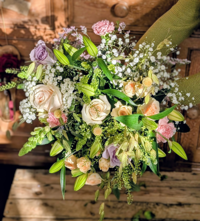 Lavish love - The most lavish arrangement in our Mother’s Day collection, this ultimate bouquet is a sweeping expression of love and devotion. Inspired by the romance of a countryside garden in full bloom, it overflows with soft ivory, blush, peach, and whispers of lavender — a palette as gentle and timeless as a mother’s love.

Abundant focal blooms are cradled by airy clouds of delicate white accents, ruffled pastel textures, and graceful green buds ready to unfurl. Flowing greenery and elegant height create a sense of movement and softness, as though it has been gathered by hand on a warm spring morning.

Grand, romantic, and filled with heartfelt beauty, this showstopping bouquet is designed to make Mum feel deeply cherished — a truly unforgettable gesture of love this Mother’s Day.

Please note: While the overall size, colour palette, and country-inspired style will remain consistent, individual varieties and shades may vary depending on seasonal availability. Any substitutions will be thoughtfully selected to preserve the bouquet’s luxurious look and feel.