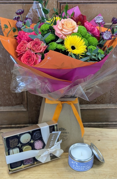 Bright Mother's day bundle - Celebrate Mum with colour, joy, and a touch of luxury with our Brights Mother’s Day Bundle. This vibrant arrangement features a stunning mix of fresh, colourful blooms, beautifully wrapped to create a cheerful bouquet that instantly brightens the room.

Paired with the flowers is a delicious selection of handcrafted chocolates for a sweet treat, alongside a beautifully scented candle to create a calm and relaxing atmosphere at home. Thoughtfully curated to bring together beauty, indulgence, and comfort, this bundle makes a wonderful way to show Mum just how much she means to you.

A bright, joyful gift designed to make her smile this Mother’s Day.